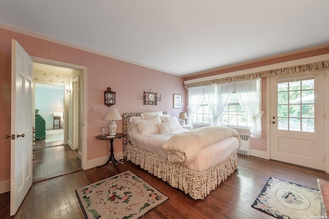 bedroom featuring radiator, crown molding, and dark hardwood / wood-style floors