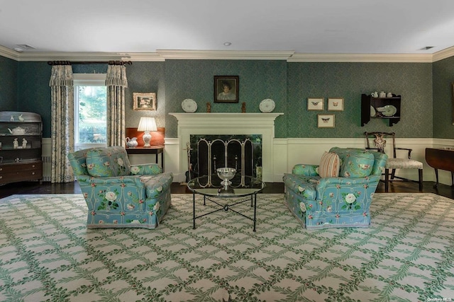 interior space featuring wood-type flooring, a premium fireplace, and ornamental molding