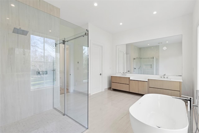 bathroom with plus walk in shower and vanity