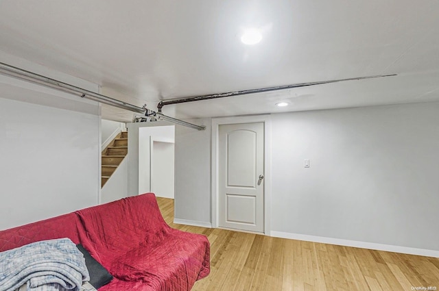 living area with hardwood / wood-style floors