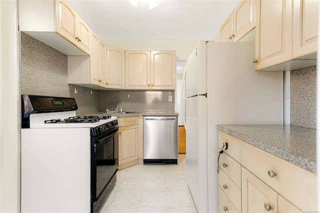 kitchen featuring white range with gas stovetop, tasteful backsplash, stainless steel dishwasher, and sink