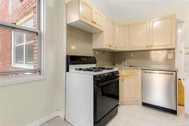 kitchen featuring tasteful backsplash, stainless steel dishwasher, white gas range, and sink