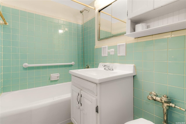 full bathroom featuring decorative backsplash, vanity, tile walls, toilet, and tiled shower / bath