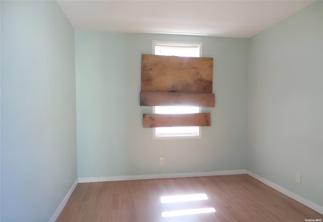 unfurnished room featuring light wood-type flooring