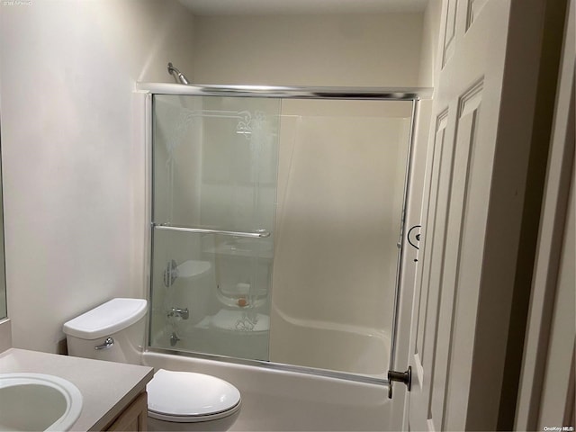 full bathroom featuring shower / bath combination with glass door, vanity, and toilet