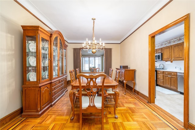 dining area featuring light parquet flooring, an inviting chandelier, and crown molding