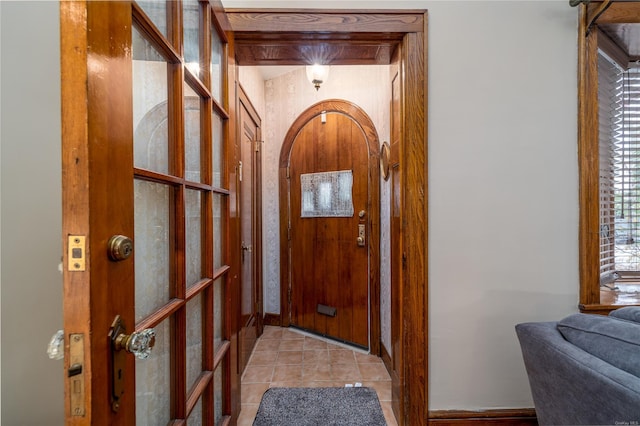 entryway with light tile patterned floors