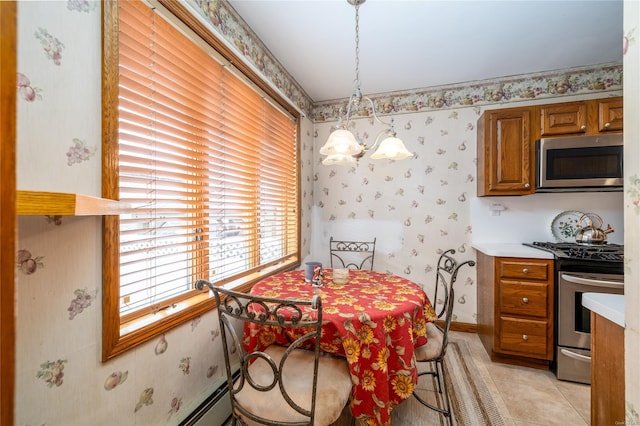 dining space featuring light tile patterned floors and an inviting chandelier