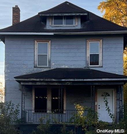 front facade with a porch