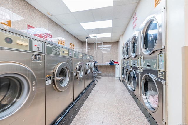 clothes washing area featuring washer and clothes dryer and stacked washer / dryer