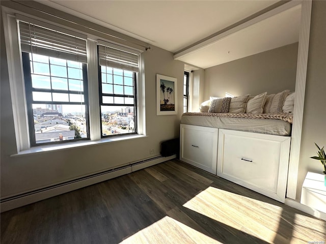 unfurnished bedroom featuring baseboard heating and dark hardwood / wood-style flooring