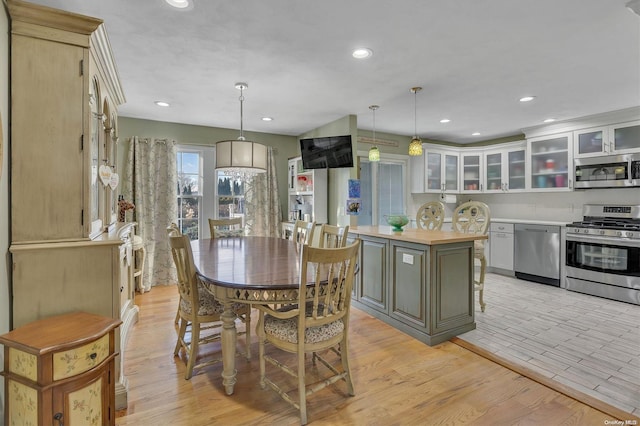 dining space featuring light wood-type flooring