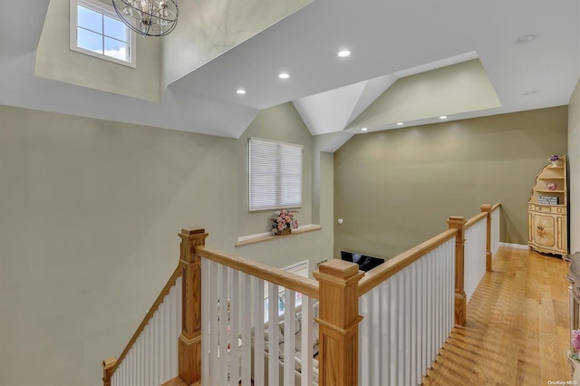 hall featuring a notable chandelier and light wood-type flooring