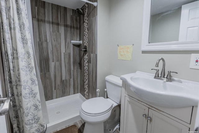 bathroom with vanity, toilet, and a shower with shower curtain