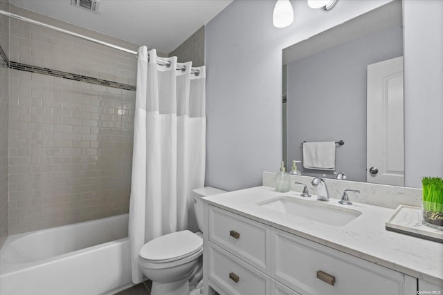 full bathroom with shower / bath combination with curtain, vanity, and toilet