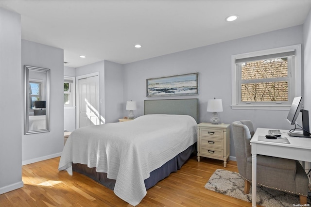 bedroom featuring a closet and light hardwood / wood-style flooring