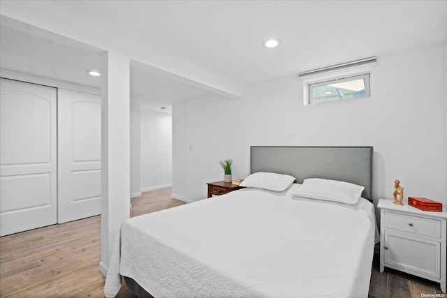 bedroom featuring a closet and hardwood / wood-style flooring