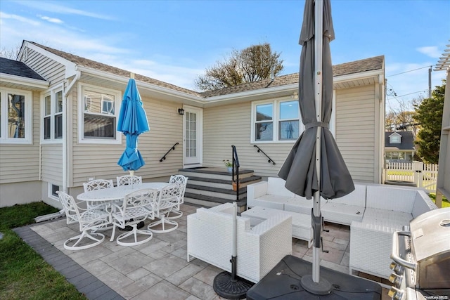 back of property with a patio area and an outdoor hangout area