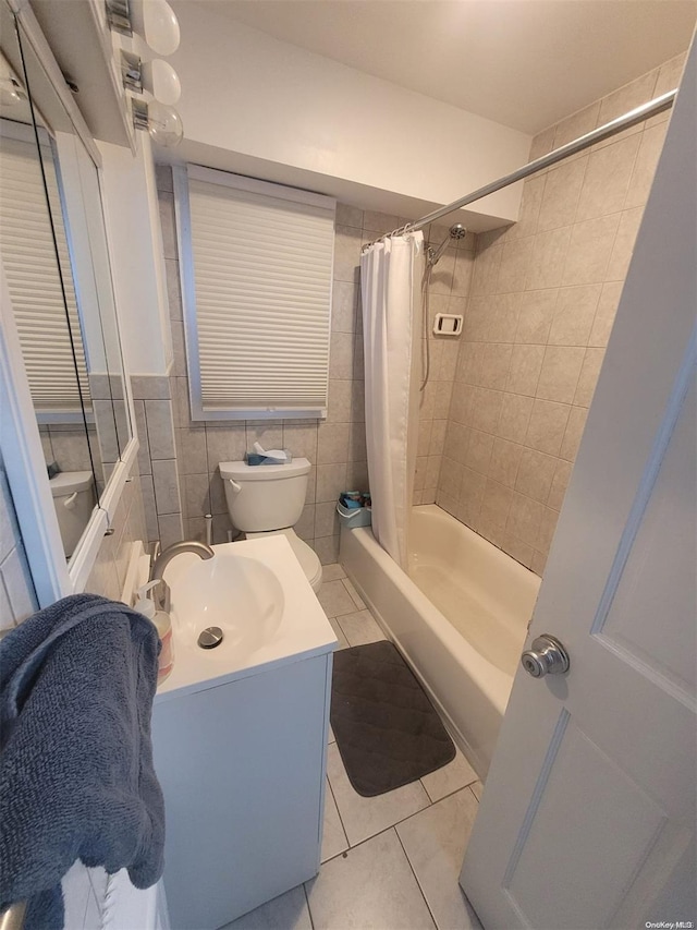 574 Lincoln St, Cedarhurst, NY 11516 - full bath with tile patterned floors, shower / tub combo with curtain, vanity, and tile walls