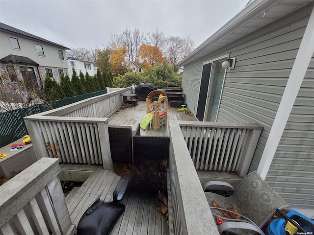 wooden deck featuring grilling area