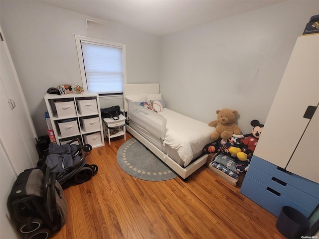 574 Lincoln St, Cedarhurst, NY 11516 - bedroom with light wood-style flooring