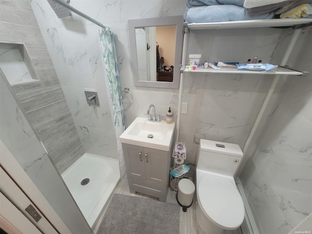 574 Lincoln St, Cedarhurst, NY 11516 - full bathroom with vanity, a stall shower, and tile walls