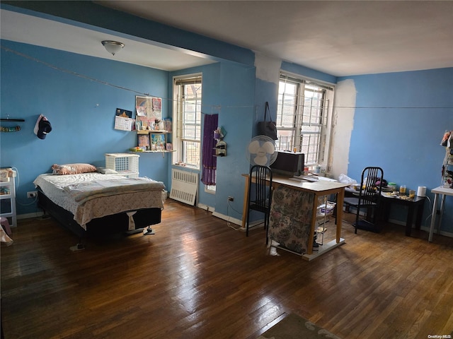 bedroom featuring radiator and dark wood-type flooring