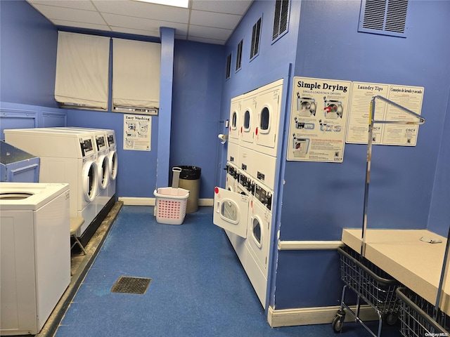 laundry room with washer and dryer and stacked washer and dryer