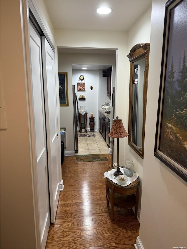 corridor with light hardwood / wood-style flooring