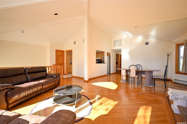 living room featuring wood-type flooring, high vaulted ceiling, and baseboard heating