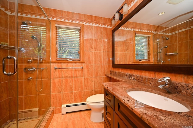 bathroom with a baseboard radiator, tile walls, and a shower with shower door