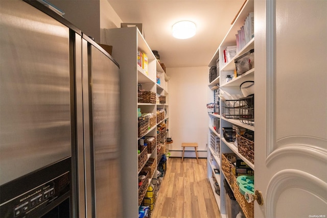 pantry featuring baseboard heating