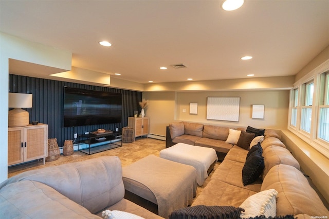 home theater room featuring baseboard heating