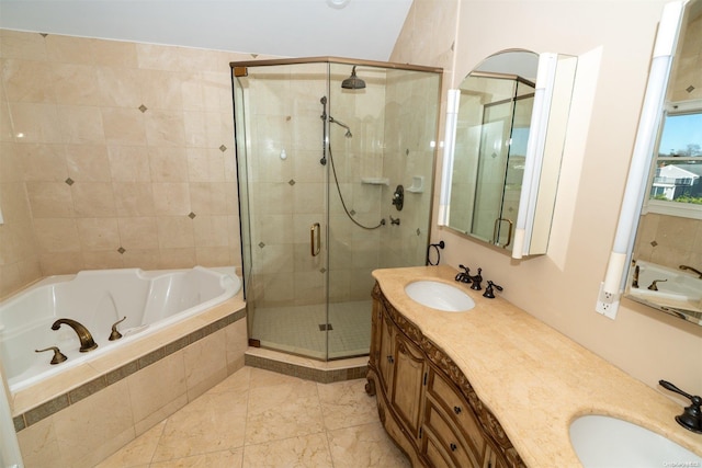 bathroom with vanity and independent shower and bath