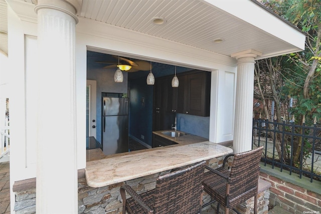 view of patio featuring an outdoor wet bar