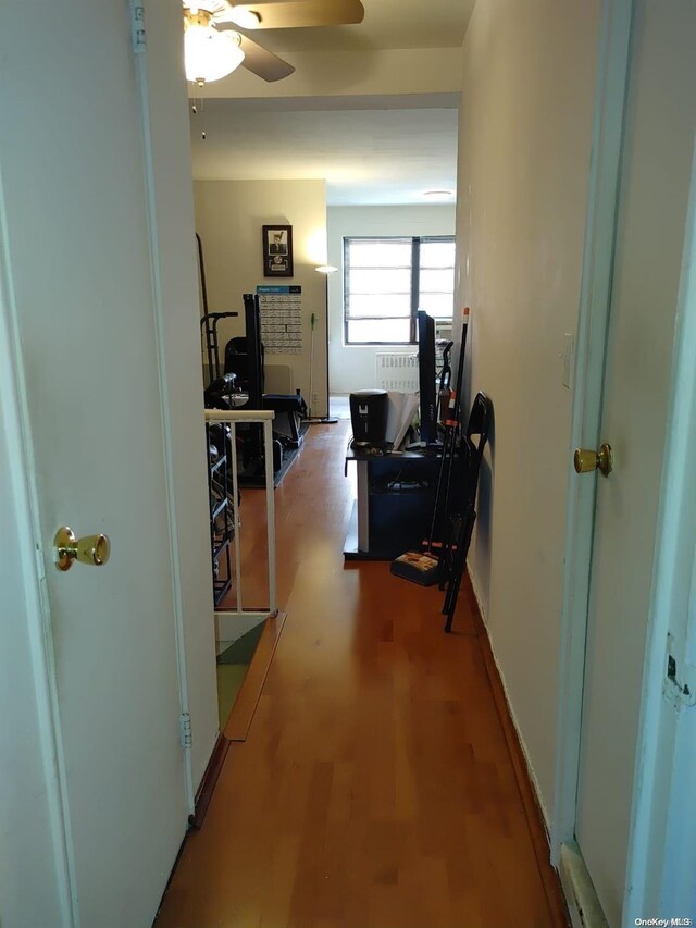99-60 63rd Rd Unit 7R, Rego Park, NY 11374 - corridor featuring a desk and wood finished floors