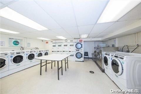 99-60 63rd Rd Unit 7R, Rego Park, NY 11374 - shared laundry room featuring stacked washer and clothes dryer, separate washer and dryer, and light floors