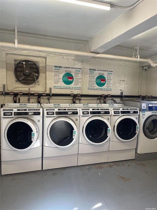 clothes washing area featuring separate washer and dryer