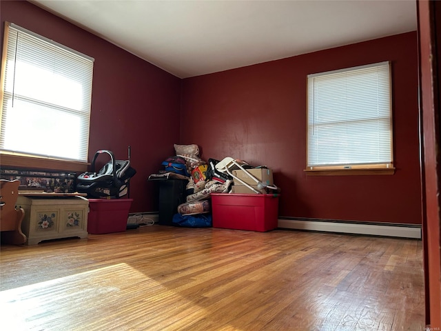 interior space featuring a baseboard radiator and light hardwood / wood-style floors