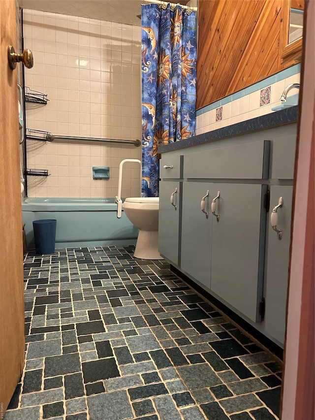 full bathroom featuring vanity, wood walls, toilet, and shower / tub combo with curtain