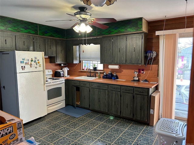 kitchen with ceiling fan, sink, and white appliances