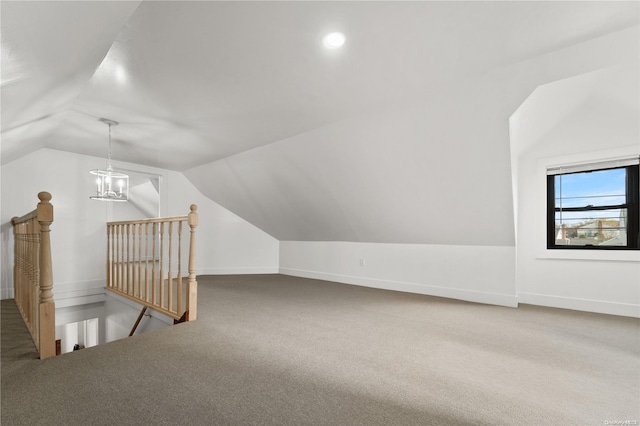 bonus room featuring carpet flooring and lofted ceiling