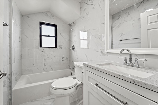 full bathroom with lofted ceiling, toilet, vanity, tile walls, and tiled shower / bath