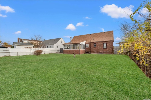 view of yard featuring a sunroom