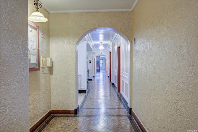 hallway featuring crown molding