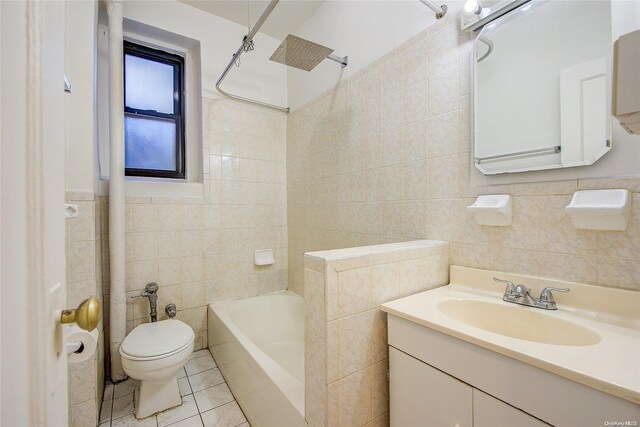 full bathroom with vanity, shower / tub combination, tile patterned floors, toilet, and tile walls