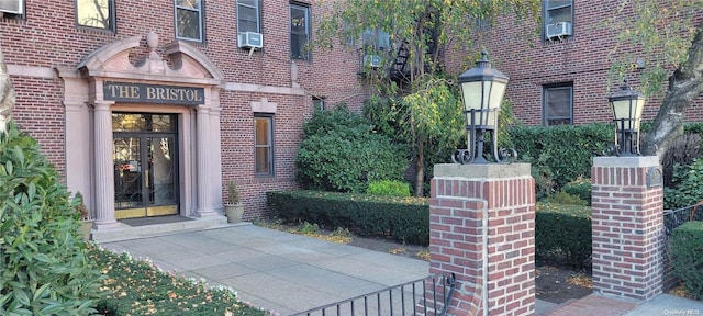 entrance to property featuring cooling unit