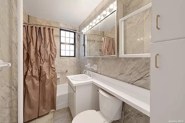 full bathroom with shower / tub combo with curtain, vanity, tile walls, and toilet