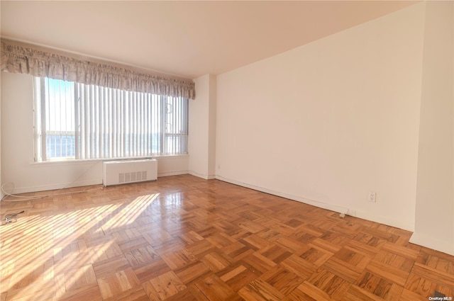 166-25 Powells Cove Blvd Unit 10G, Whitestone, NY 11357 - unfurnished room featuring radiator and baseboards