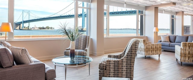 166-25 Powells Cove Blvd Unit 10G, Whitestone, NY 11357 - living room featuring plenty of natural light, a water view, and baseboards